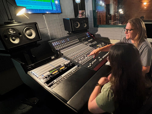 Engineers and students at SUNY Broome Community College working with a Universal Audio Apollo interface and Audient ASP4816 console.